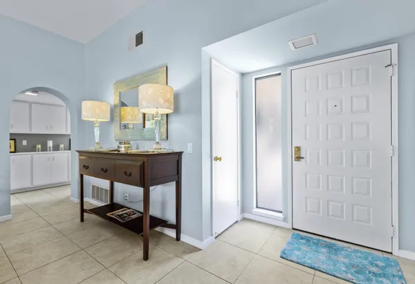 a workspace with a table and chairs