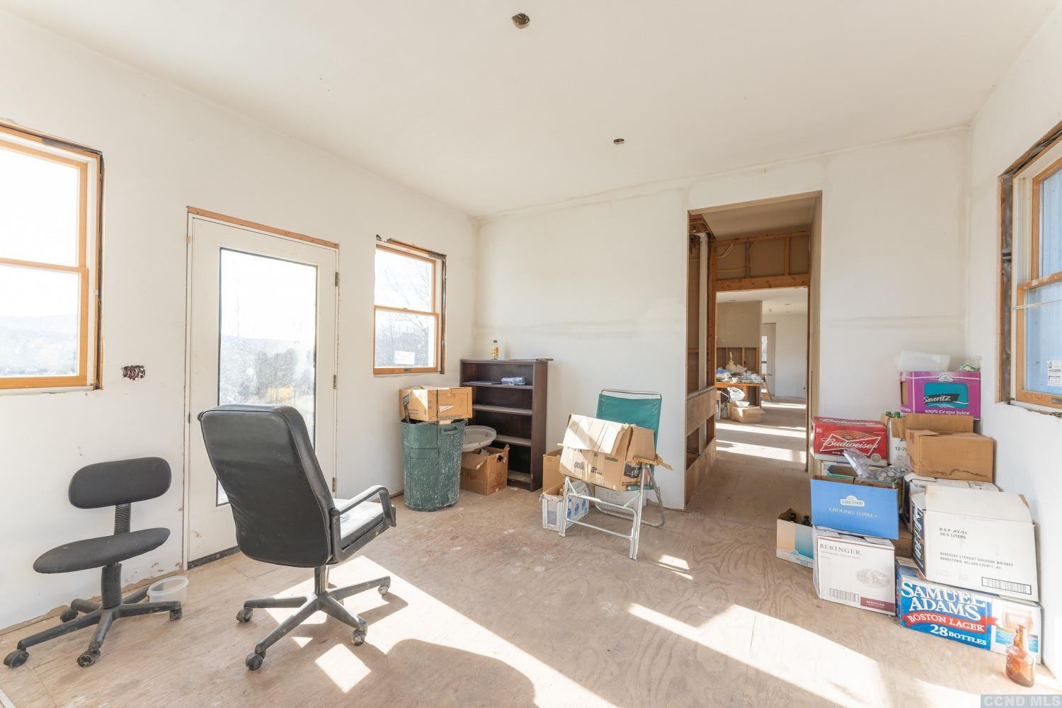 1174 Potter Mountain Road Gilboa, NY 12076 - Photo 34 of 94 a living room with furniture and a large window