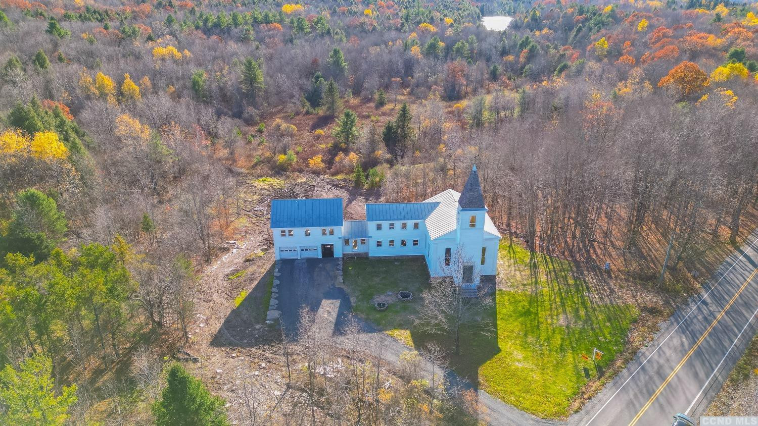 1174 Potter Mountain Road Gilboa, NY 12076 - Photo 4 of 94 a aerial view of a house with swimming pool and large trees
