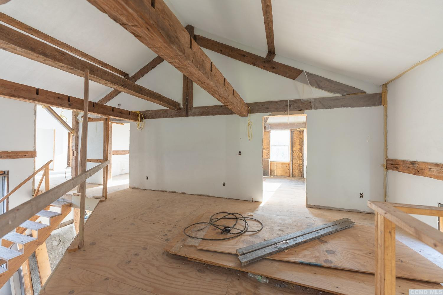 1174 Potter Mountain Road Gilboa, NY 12076 - Photo 51 of 94 a view of a hallway with wooden floor and staircase