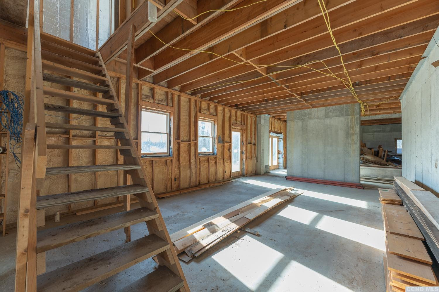 1174 Potter Mountain Road Gilboa, NY 12076 - Photo 63 of 94 a view of an empty room with wooden floor and a window