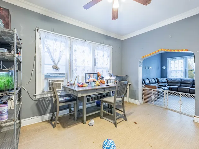 a dining room with furniture and window