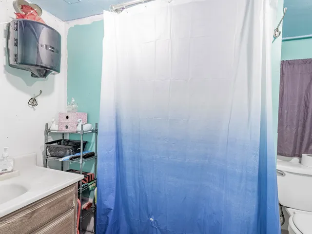 a room with cabinets and wooden floor