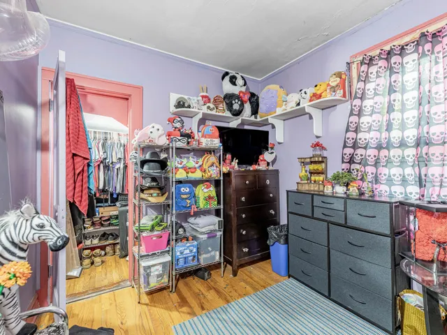 a living room filled with furniture and a wooden floor