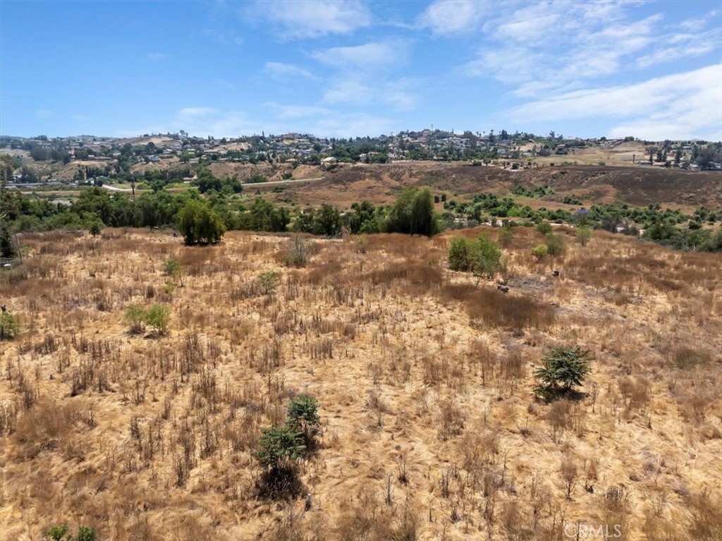 1350 Firethorn Avenue Riverside, CA 92504 - Photo 16 of 16 a view of a lake with mountains in the background