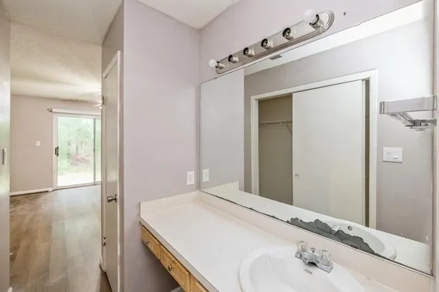 a en suite bathroom with a sink and mirror