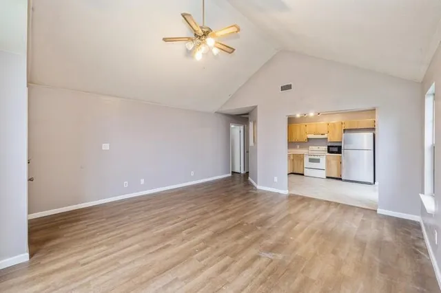 wooden floor in an empty room with a window