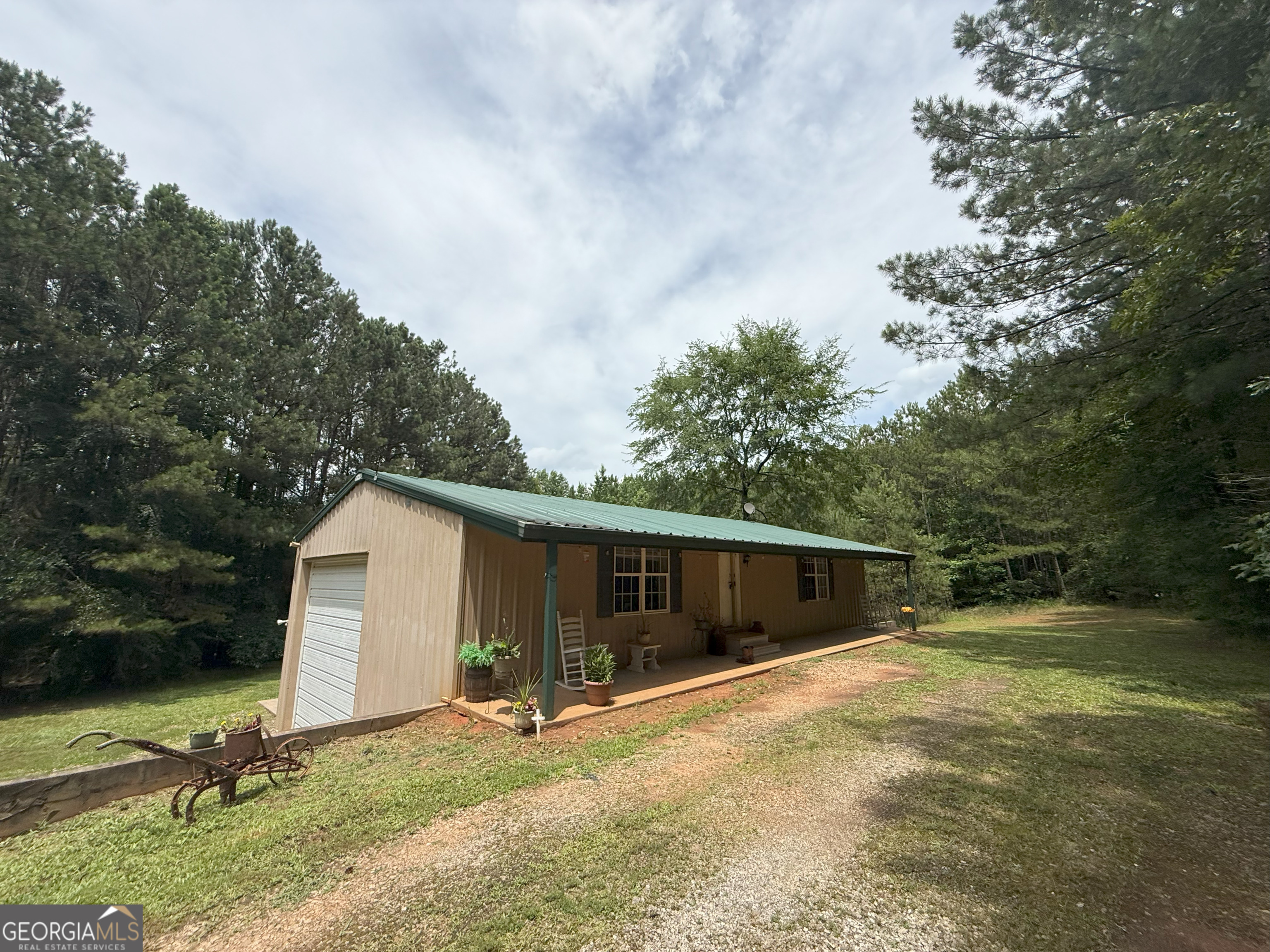 2227 Aonia Road Washington, GA 30673 - Photo 1 of 1 a view of a house with backyard and a tree
