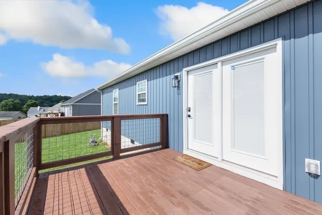 a view of a porch with wooden floor