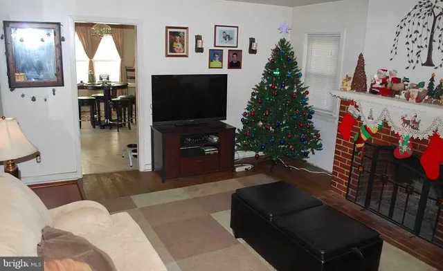 a living room with furniture and a mirror