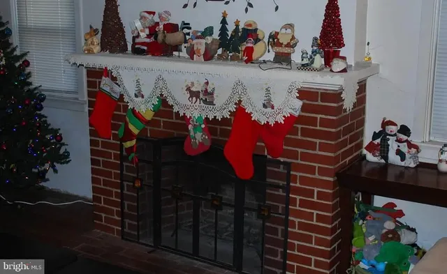 a view of a livingroom with furniture and a window