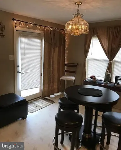 a bathroom with a sink toilet and a mirror