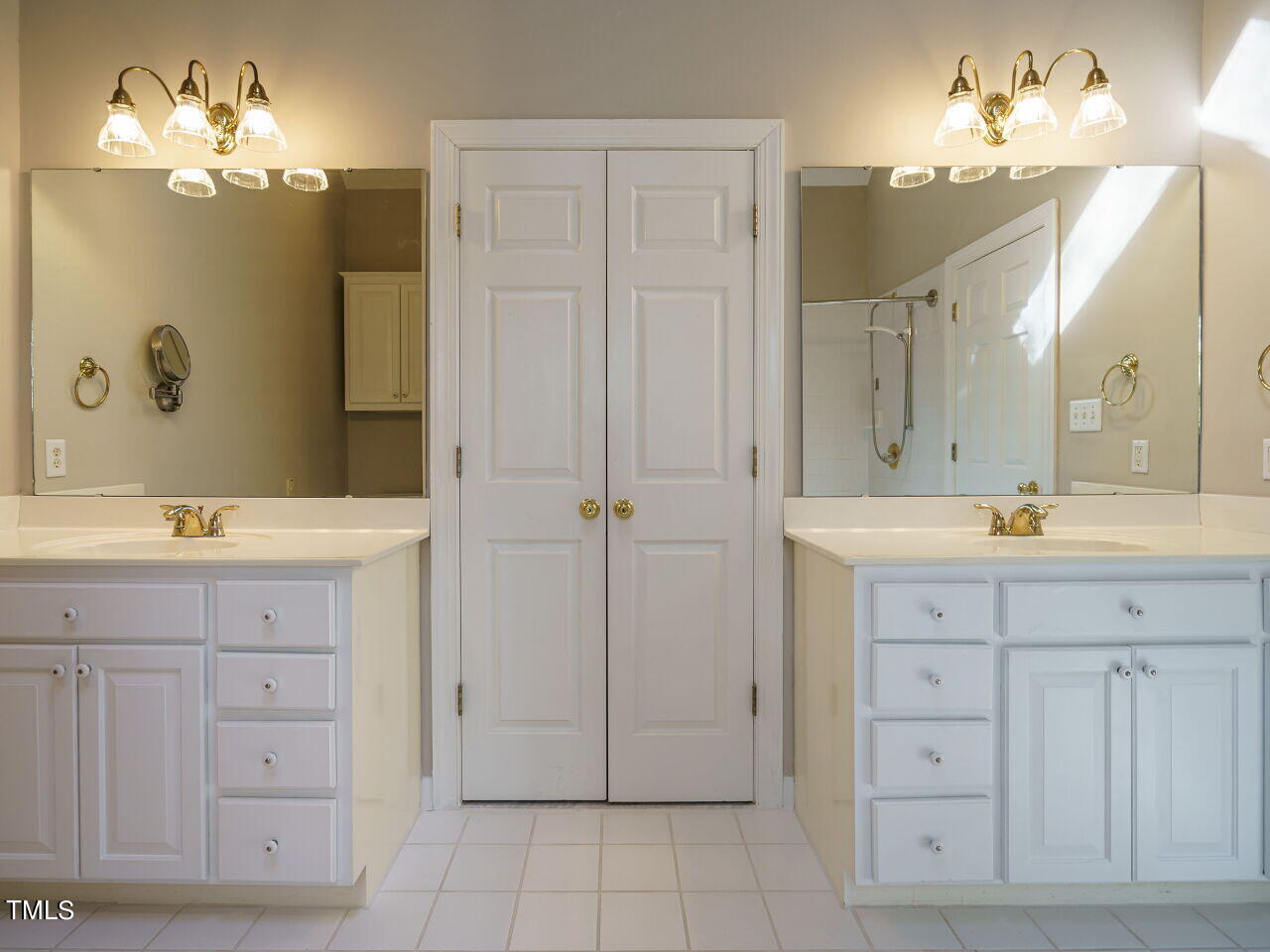 2320 Primrose Valley Court Raleigh, NC 27613 - Photo 29 of 43 a bathroom with a double vanity sink mirror and