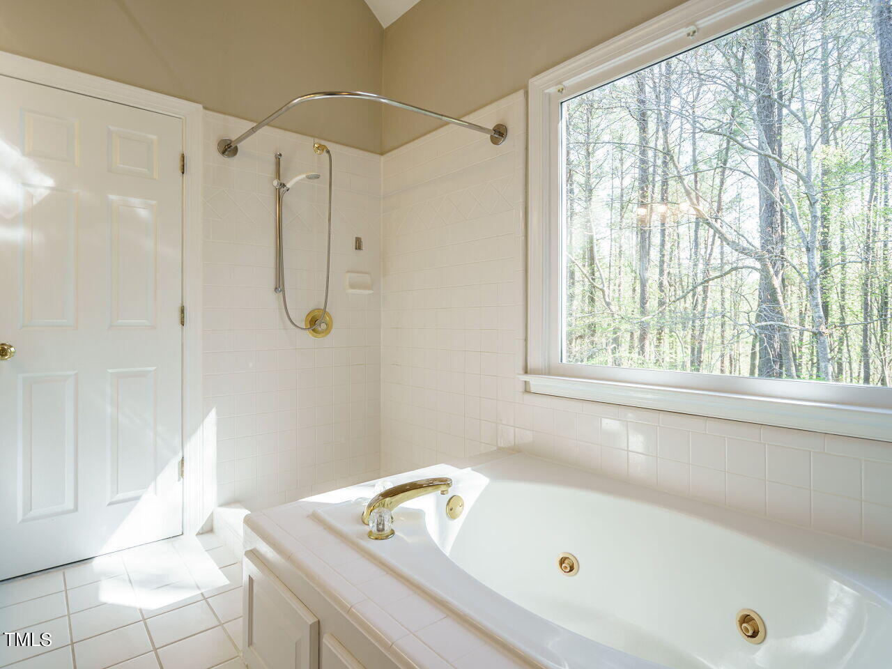 2320 Primrose Valley Court Raleigh, NC 27613 - Photo 30 of 43 a bathroom with a tub a sink and a window
