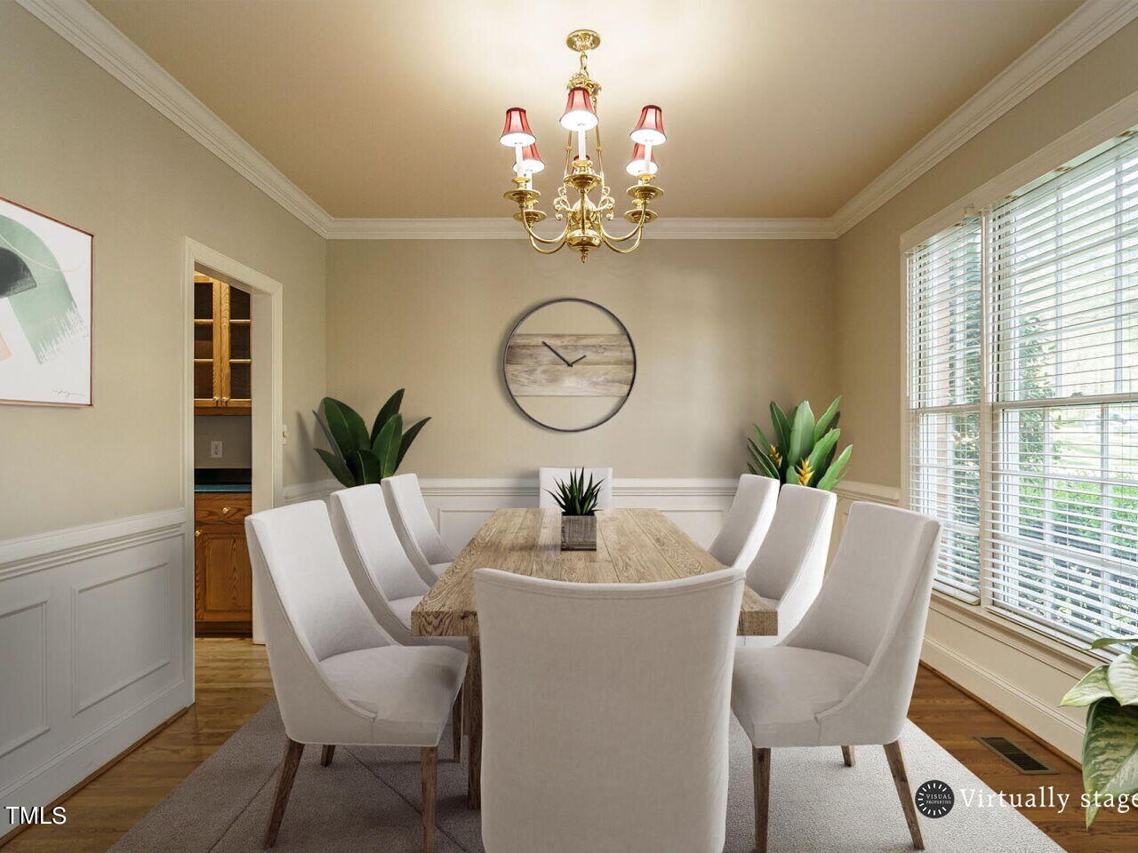 2320 Primrose Valley Court Raleigh, NC 27613 - Photo 7 of 43 a dining room with furniture a potted plant and a chandelier