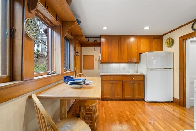 a kitchen with refrigerator and stove