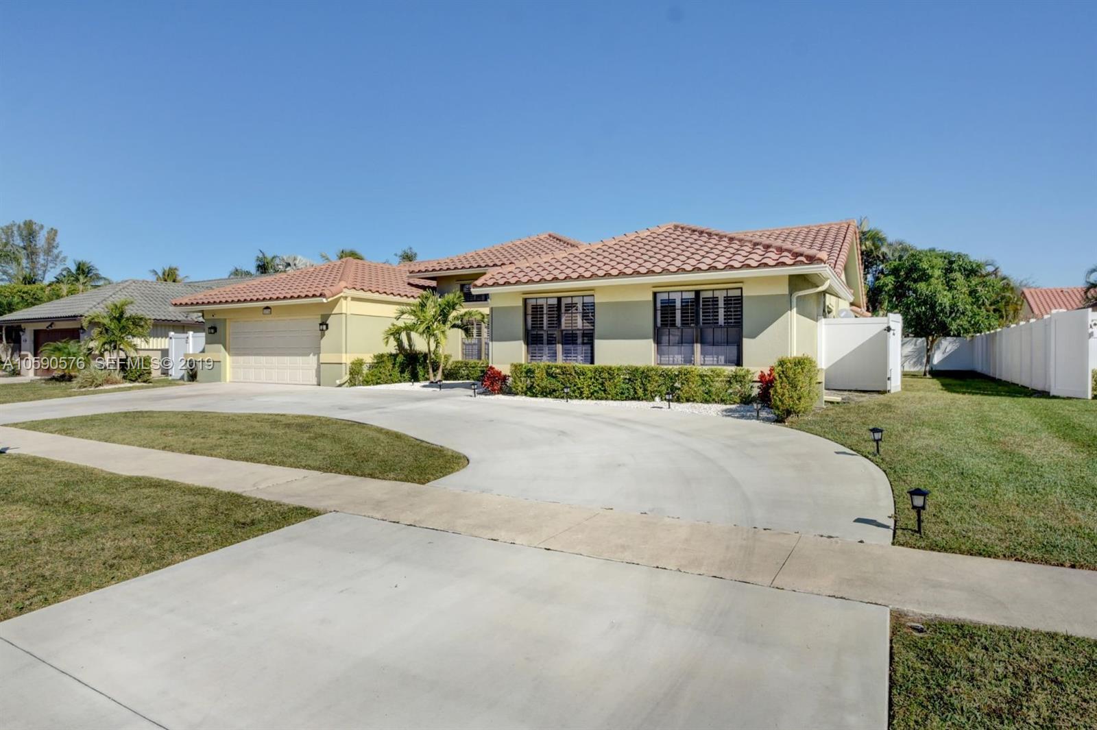 22324 Boyaca Avenue Boca Raton, FL 33433 - Photo 28 of 51 a house view with a garden space