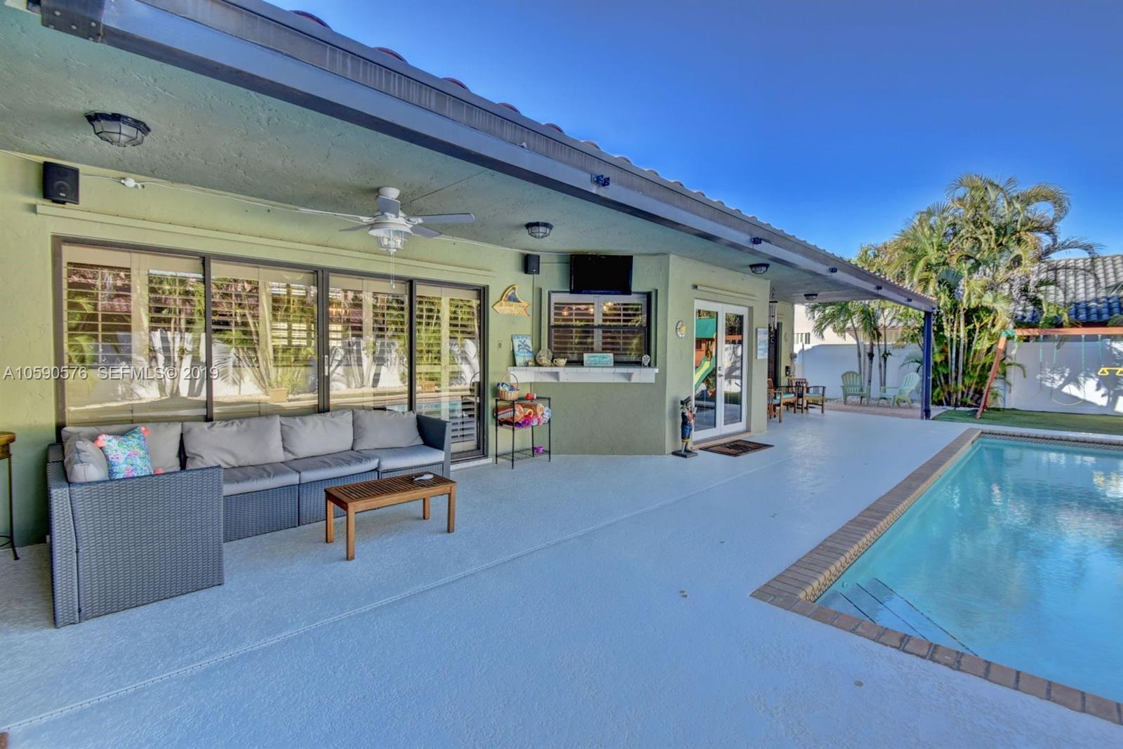 22324 Boyaca Avenue Boca Raton, FL 33433 - Photo 34 of 51 a living room with furniture and a large window
