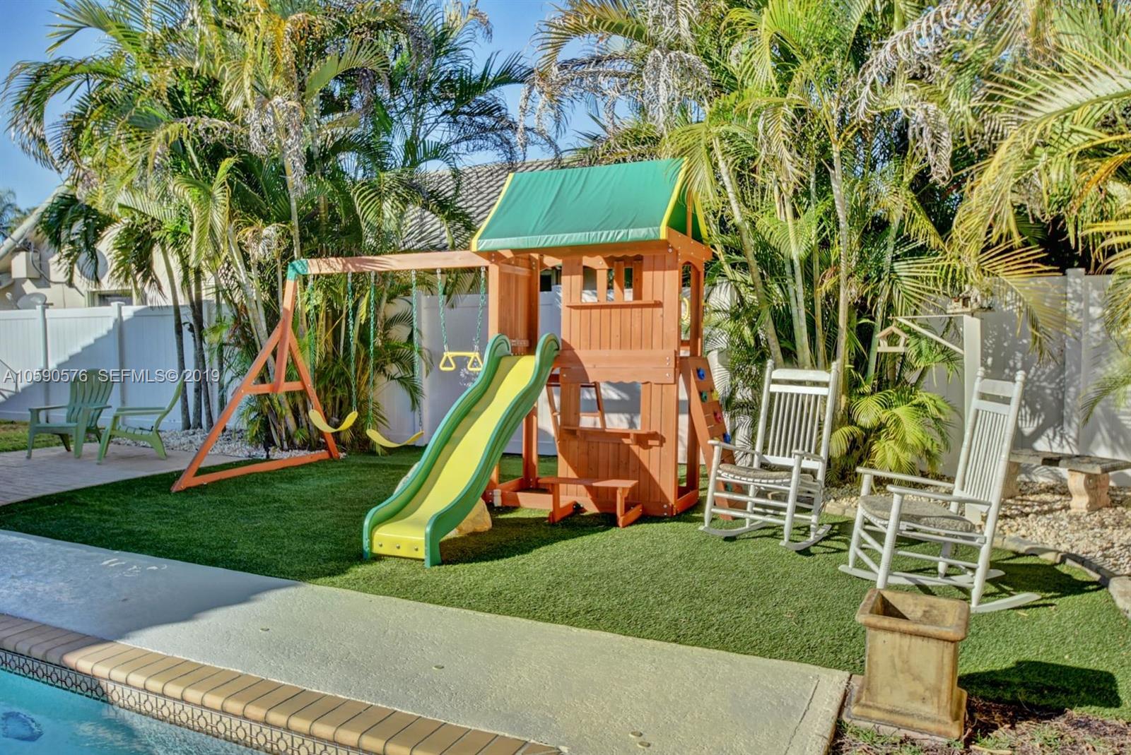 22324 Boyaca Avenue Boca Raton, FL 33433 - Photo 41 of 51 a view of a park with a slide