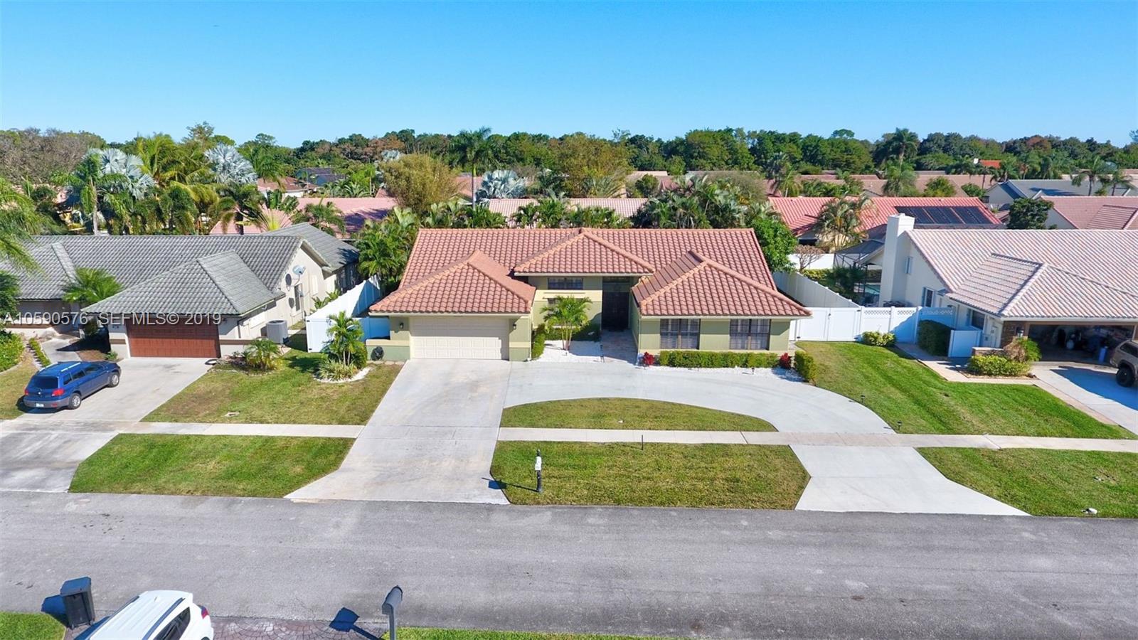 22324 Boyaca Avenue Boca Raton, FL 33433 - Photo 44 of 51 an aerial view of a house with a garden and lake view