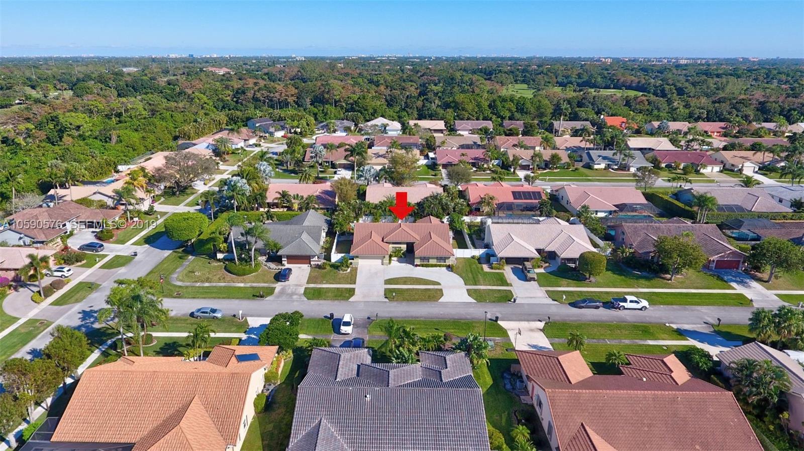 22324 Boyaca Avenue Boca Raton, FL 33433 - Photo 45 of 51 an aerial view of residential houses with outdoor space and trees all around