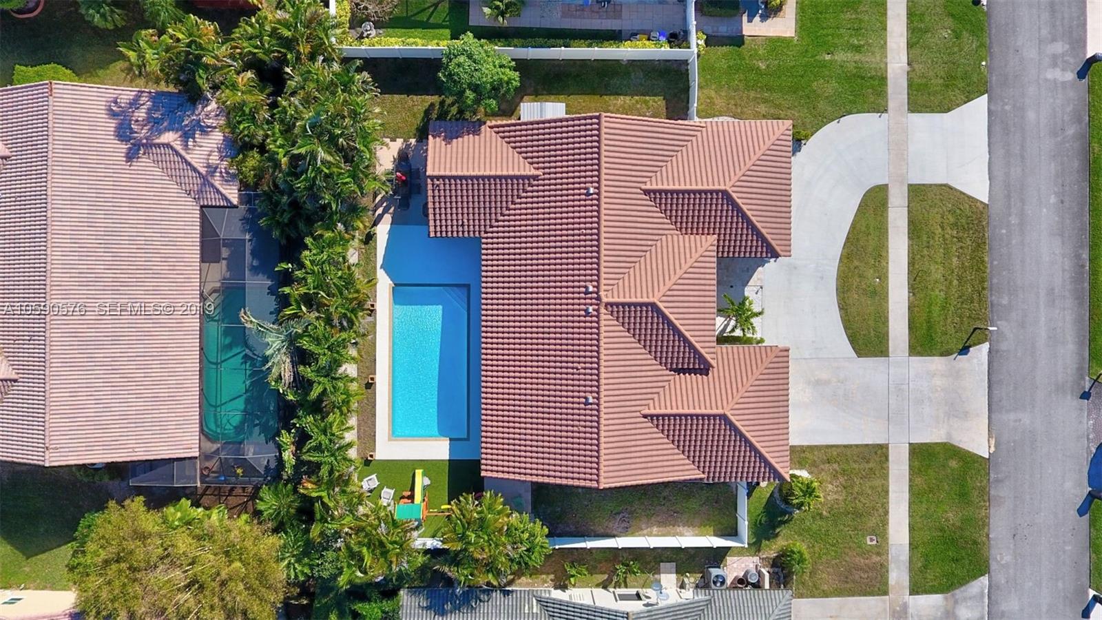22324 Boyaca Avenue Boca Raton, FL 33433 - Photo 51 of 51 a aerial view of a house with garden and plants