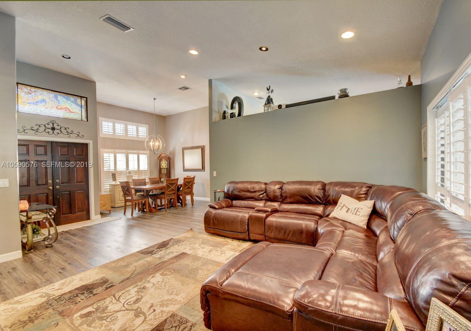 22324 Boyaca Avenue Boca Raton, FL 33433 - Photo 10 of 51 a bed room with furniture and a window