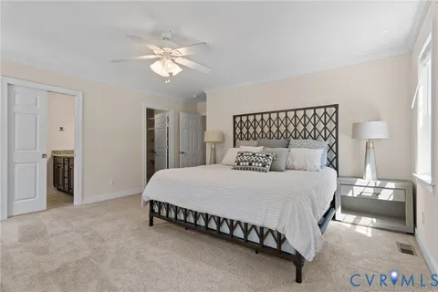 a bathroom with a granite countertop sink a light fixture and a mirror