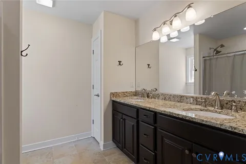 a view of walk in closet with clothes