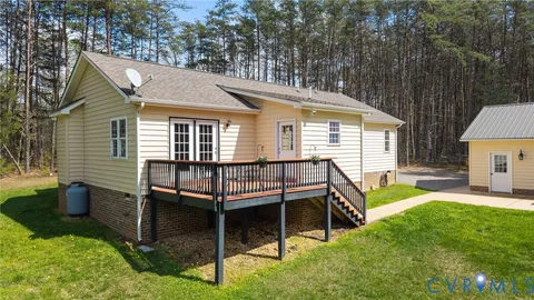 a front view of house with outdoor seating