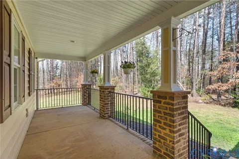 a view of a porch with wooden floor and outdoor space