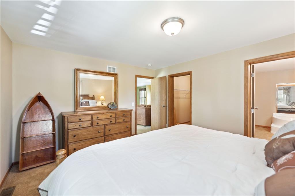 226 Cypress Road Addison, PA 15411 - Photo 14 of 31 a spacious bedroom with a large bed and a dresser