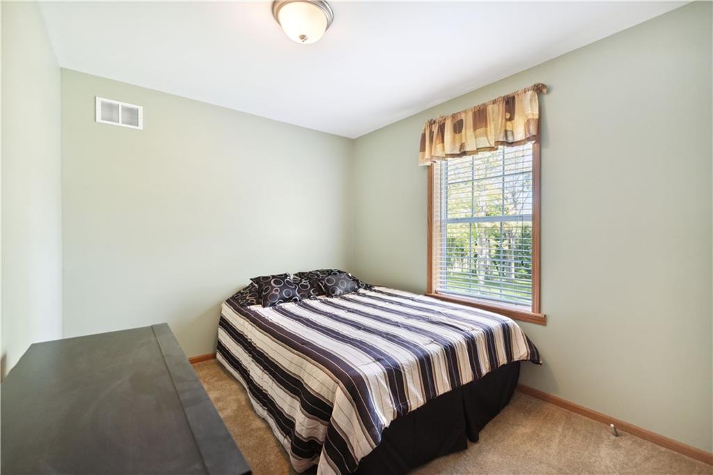 226 Cypress Road Addison, PA 15411 - Photo 20 of 31 a bedroom with a bed and wooden floor