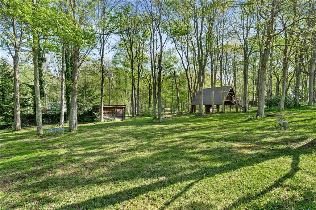 226 Cypress Road Addison, PA 15411 - Photo 29 of 31 a backyard of a house with table and chairs