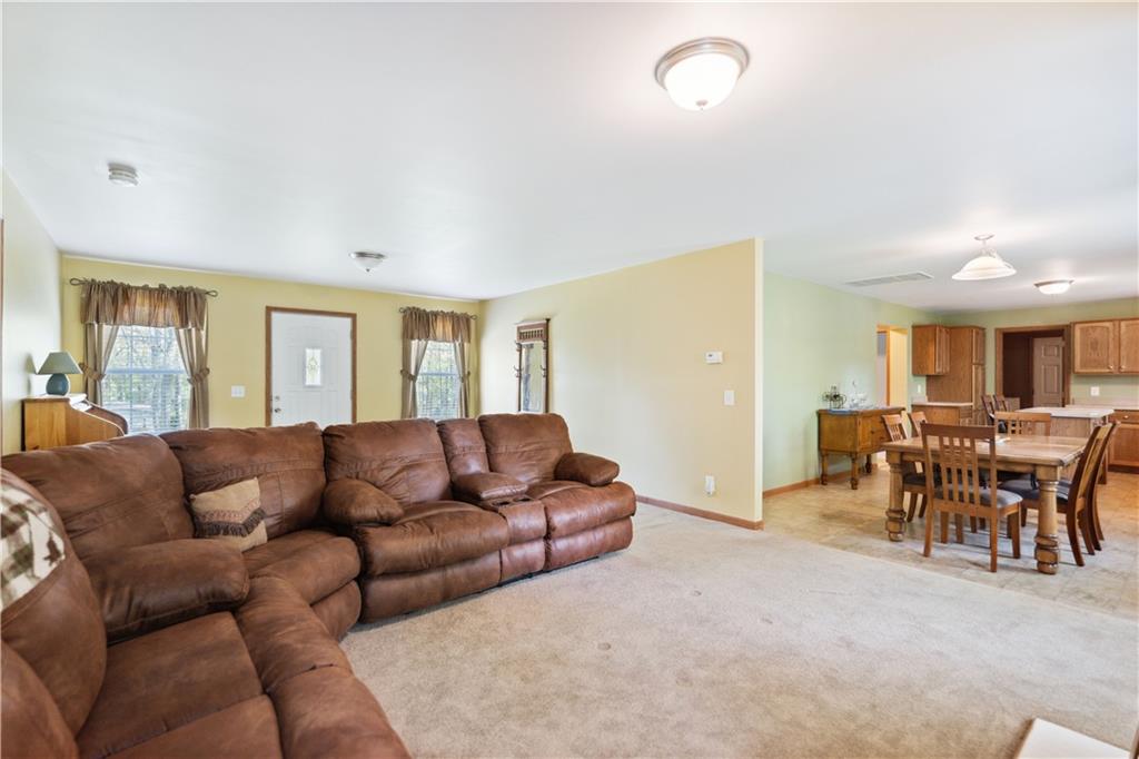 226 Cypress Road Addison, PA 15411 - Photo 10 of 31 a living room with furniture and a dining table