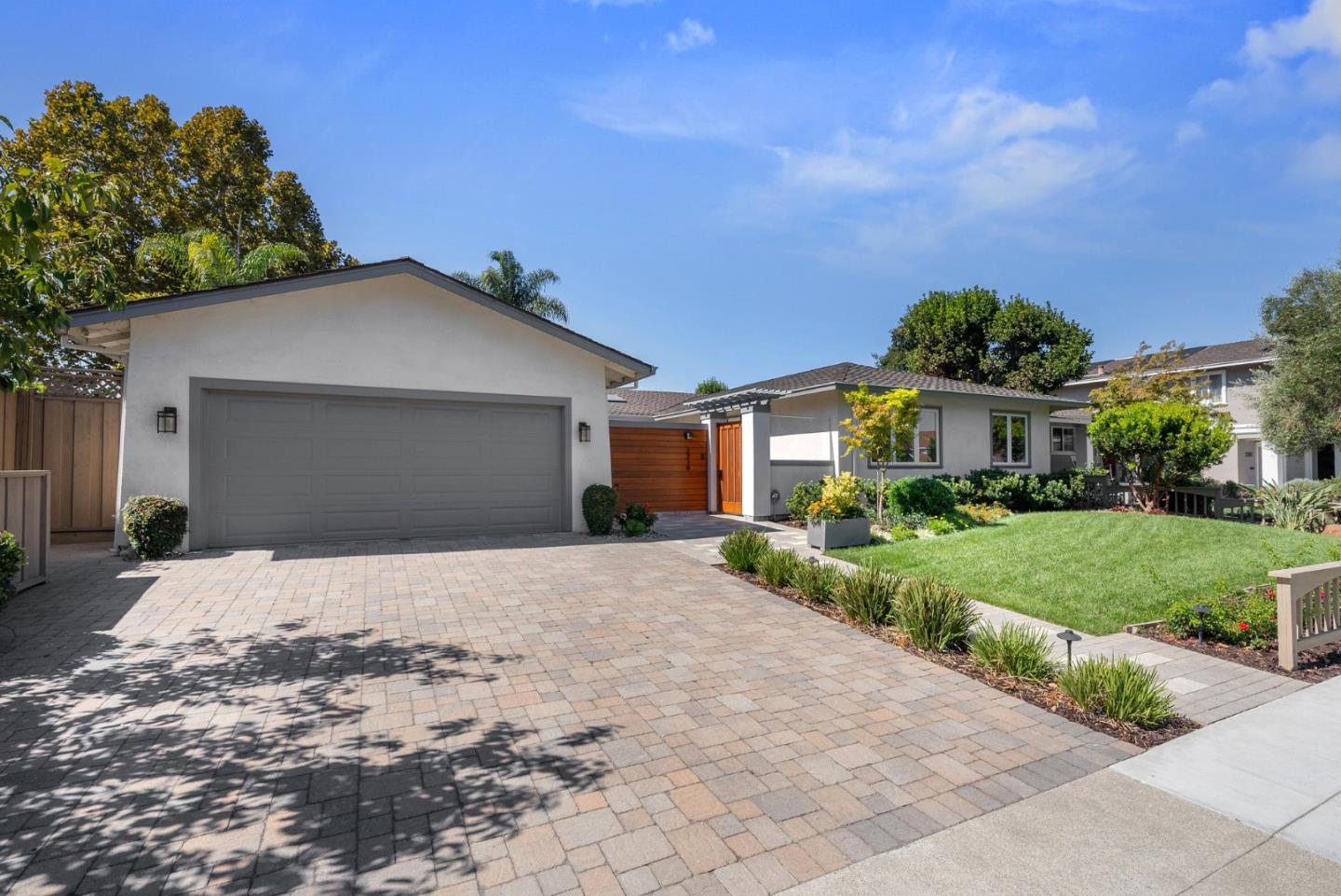 2219 Maykirk Road San Jose, CA 95124 - Photo 4 of 100 a front view of a house with a yard and garage