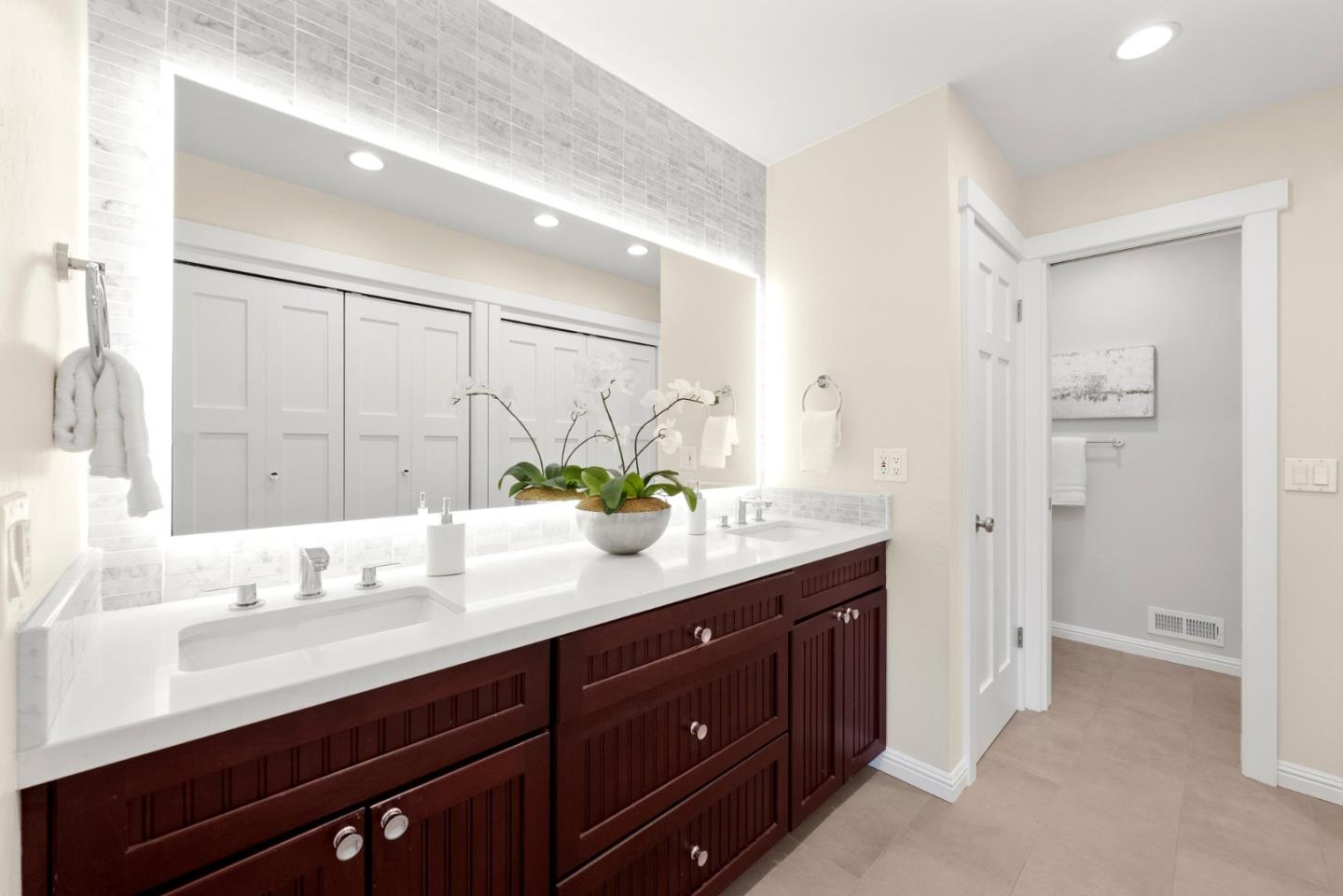 2219 Maykirk Road San Jose, CA 95124 - Photo 60 of 100 a bathroom with a sink double vanity and a mirror