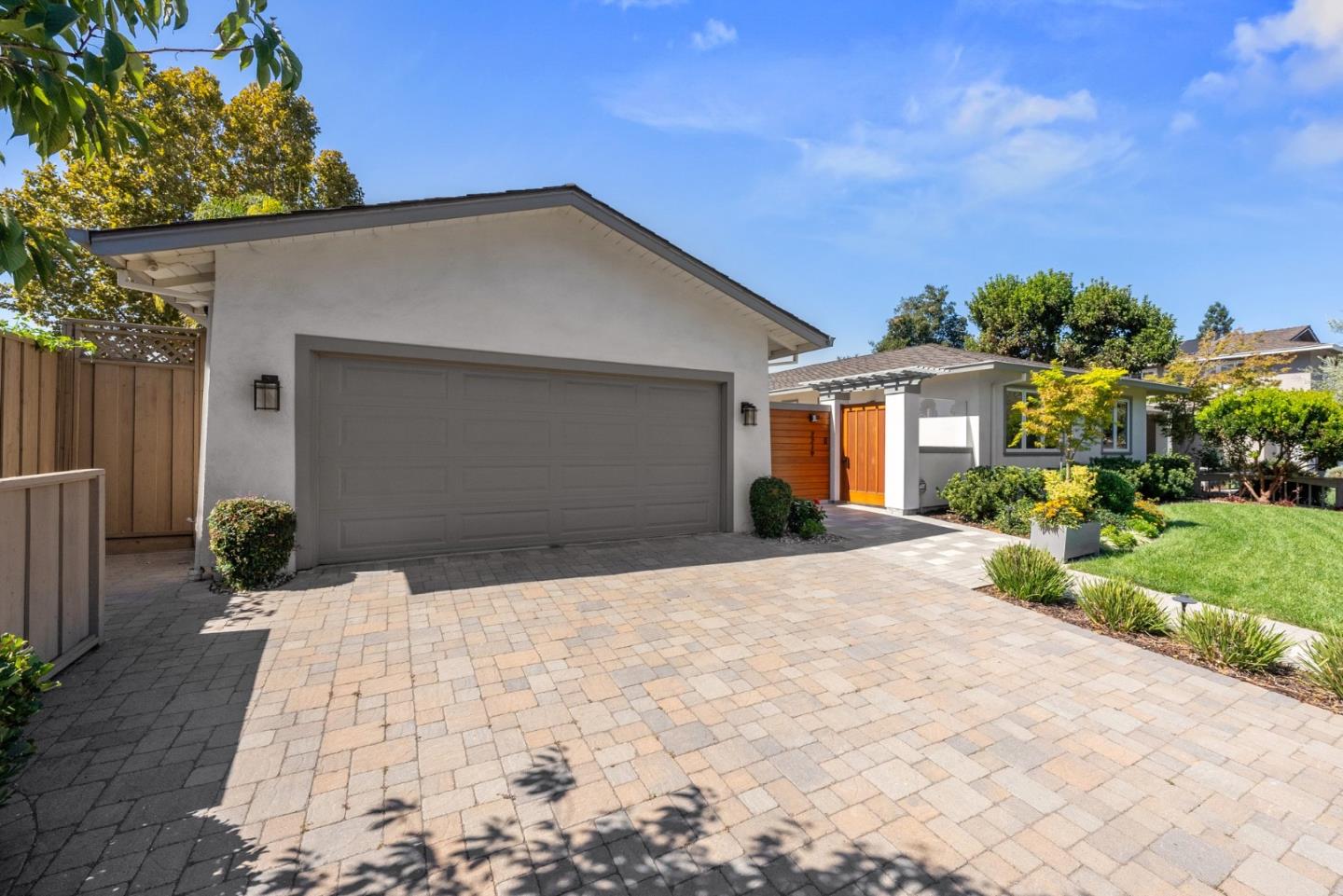 2219 Maykirk Road San Jose, CA 95124 - Photo 6 of 100 a front view of a house with a yard and garage