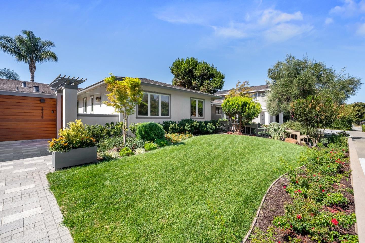 2219 Maykirk Road San Jose, CA 95124 - Photo 7 of 100 a front view of a house with a yard