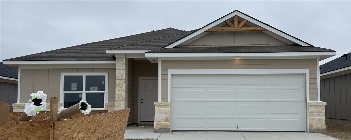 a front view of a house with seating space