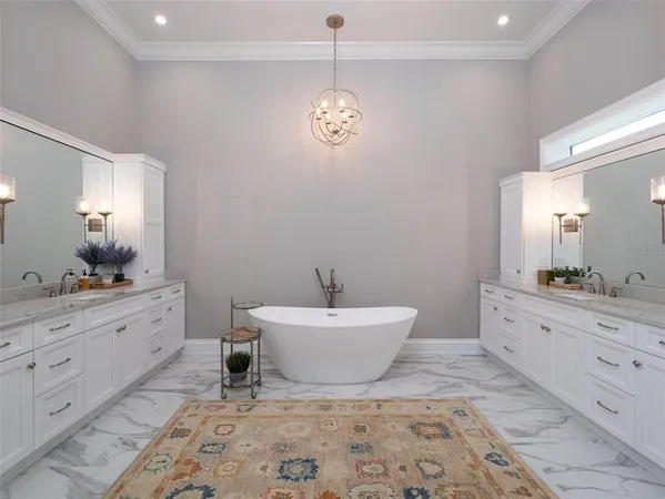 a spacious bathroom with a granite countertop sink and a mirror