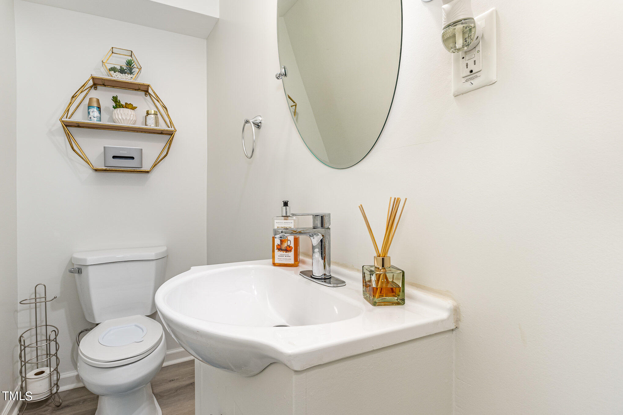 5400 Razan Street Raleigh, NC 27616 - Photo 15 of 27 a bathroom with a toilet and a sink