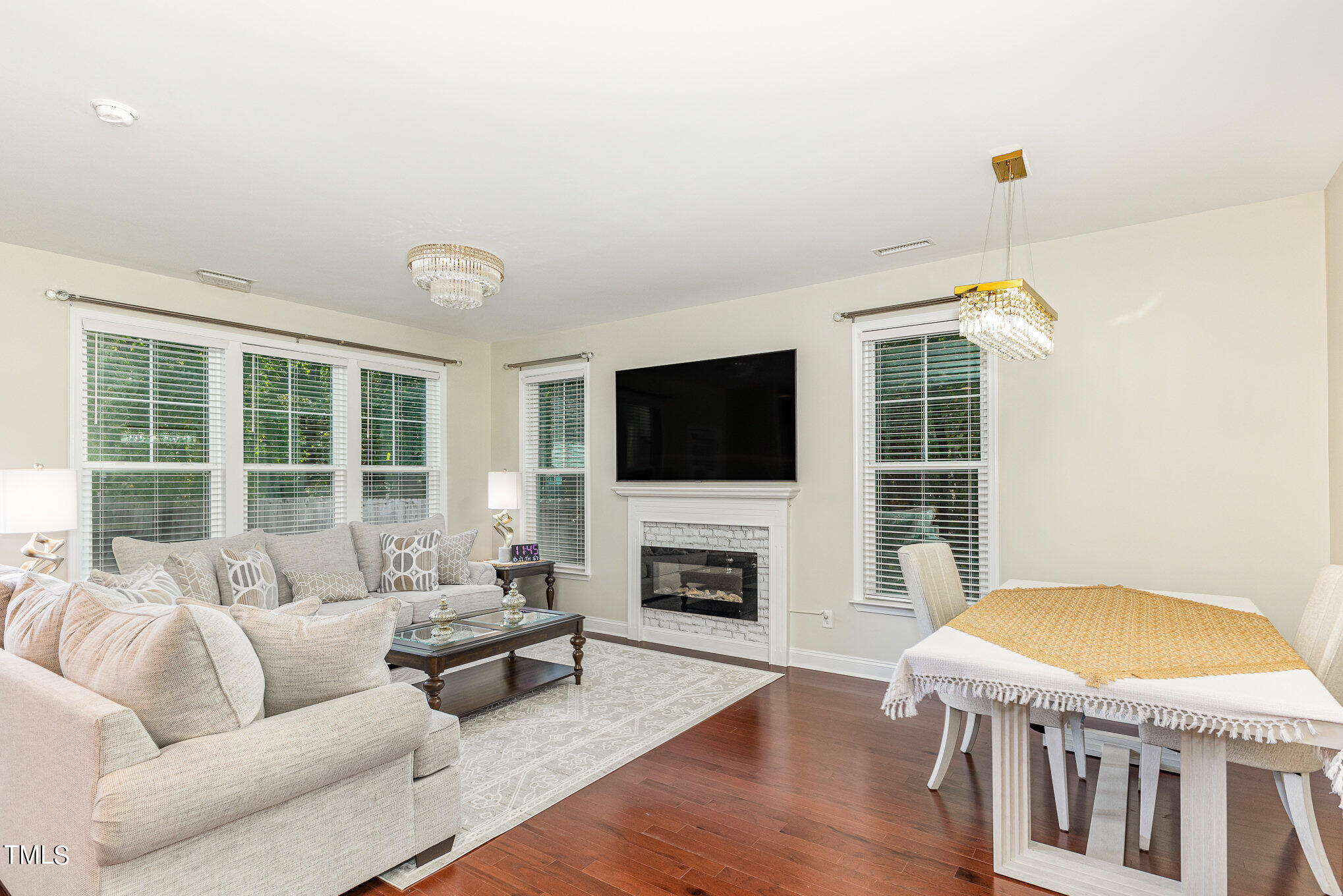 5400 Razan Street Raleigh, NC 27616 - Photo 8 of 27 a living room with furniture fireplace and a flat screen tv