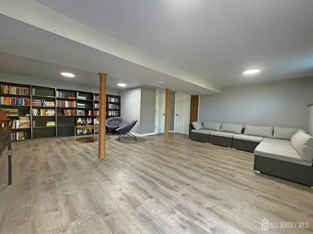 a view of a livingroom with furniture and an empty room