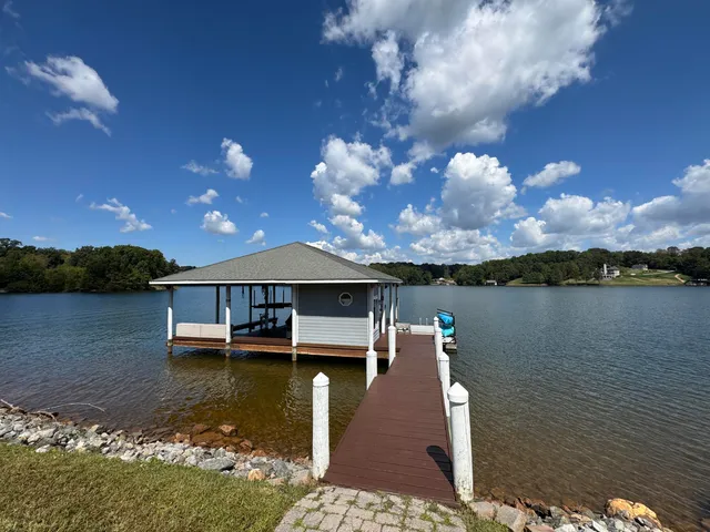 a view of a lake with a house in the background