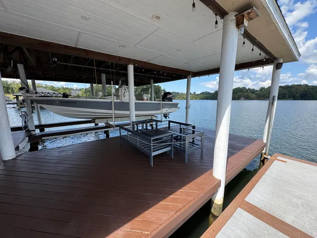 a view of a patio with table and chairs