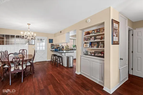 a kitchen with stainless steel appliances granite countertop a refrigerator and microwave