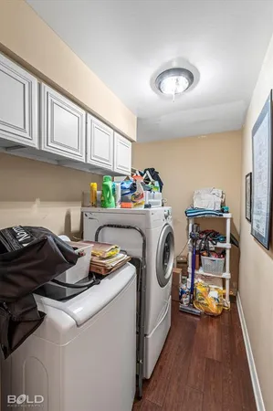a utility room with sink dryer and washer