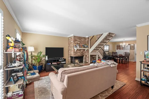 a living room with lots of furniture and a flat screen tv
