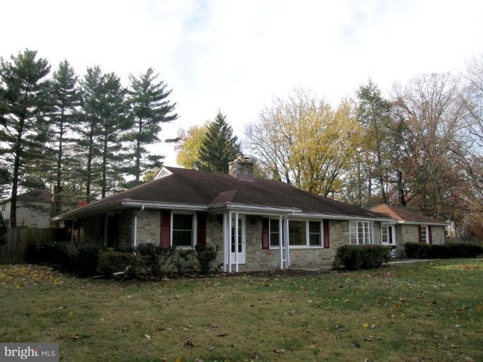 9217 Frederick Road Ellicott City, MD 21042 - Photo 1 of 22 a front view of a house with a garden